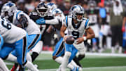 Nov 16, 2025; Atlanta, Georgia, USA; Carolina Panthers quarterback Bryce Young (9) hands the ball off in the fourth quarter against the Atlanta Falcons at Mercedes-Benz Stadium. Mandatory Credit: Brett Davis-Imagn Images