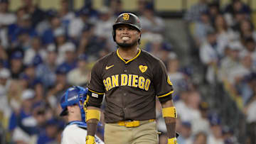 Oct 11, 2024; Los Angeles, California, USA; San Diego Padres first baseman Luis Arraez (4) reacts at bat in the sixth inning against the Los Angeles Dodgers during game five of the NLDS for the 2024 MLB Playoffs at Dodger Stadium. Mandatory Credit: Jayne Kamin-Oncea-Imagn Images
