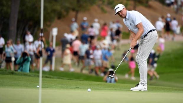 Golfer Keegan Bradley putts within one foot of the hole on the 17th during the third round of the BMW Championship.