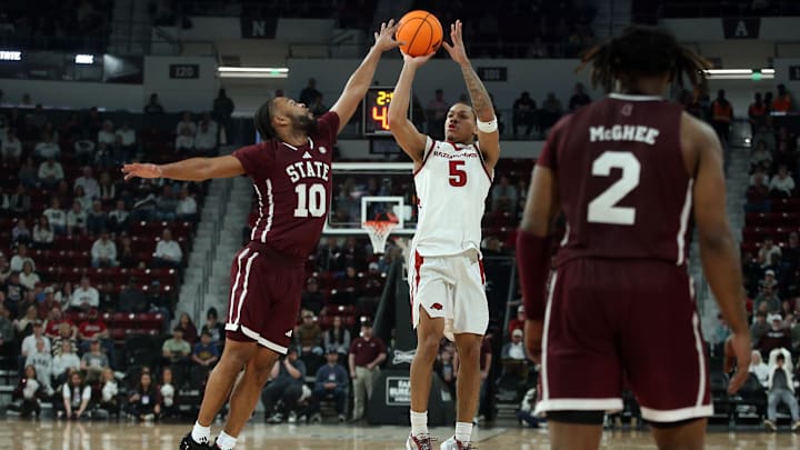 Feb 7, 2026; Starkville, Mississippi, USA; Arkansas Razorbacks guard Darius Acuff Jr. (5) shoots as Mississippi State Bulldogs guard Jayden Epps (10) defends during the first half at Humphrey Coliseum. Mandatory Credit: Petre Thomas-Imagn Images