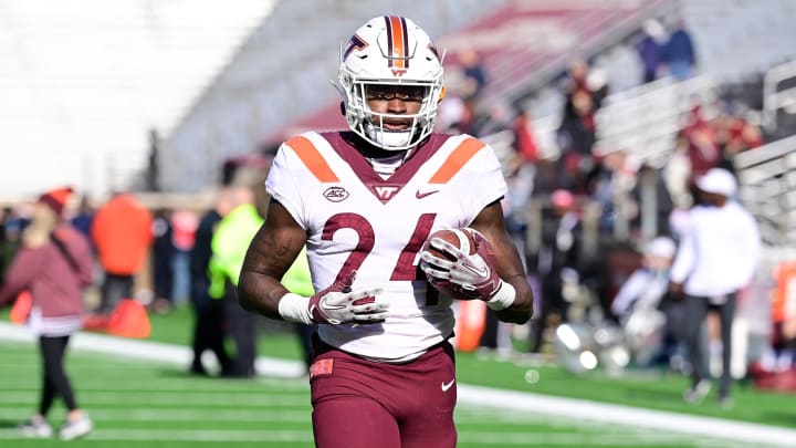 Nov 11, 2023; Chestnut Hill, Massachusetts, USA; Virginia Tech Hokies running back Malachi Thomas (24) warms up before a game against the Boston College Eagles at Alumni Stadium. Mandatory Credit: Eric Canha-USA TODAY Sports