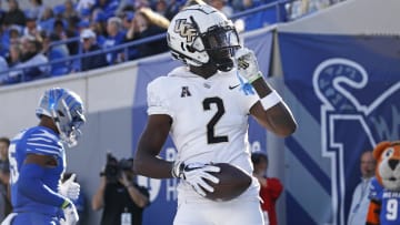 Nov 5, 2022; Memphis, Tennessee, USA; UCF Knights wide receiver Kobe Hudson (2) reacts after a touchdown catch during the first half against the Memphis Tigers  at Liberty Bowl Memorial Stadium. Mandatory Credit: Petre Thomas-USA TODAY Sports