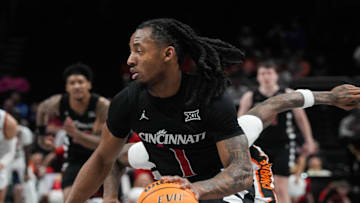 Bearcats Day Day Thomas (1) heads for the hoop during Game 1 of the 2025 Phillips 66 Big 12 Basketball Championship against the Oklahoma State Cowboys at the T-Mobile Center in Kansas City, Missouri on Tuesday March 11, 2025. Bearcats lead the game at halftime with a score of 38-26.