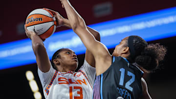Connecticut Sun center Rayah Marshall (13) shoots the ball against Atlanta Dream forward Nia Coffey (12) during the fourth quarter at Gateway Center Arena at College Park. 