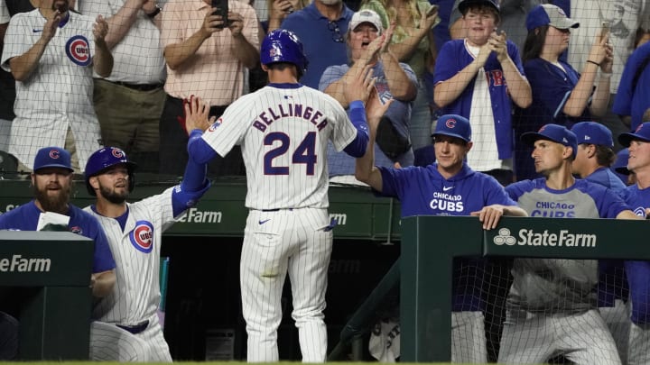 Jun 18, 2024; Chicago, Illinois, USA; Chicago Cubs outfielder Cody Bellinger (24) is greeted after scoring against the San Francisco Giants during the eighth inning at Wrigley Field. Mandatory Credit: David Banks-USA TODAY Sports