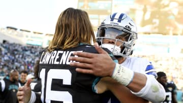 Dec 18, 2022; Jacksonville, Florida, USA; Jacksonville Jaguars quarterback Trevor Lawrence (16) meets with Dallas Cowboys quarterback Dak Prescott (4) postgame at TIAA Bank Field. Mandatory Credit: Melina Myers-USA TODAY Sports