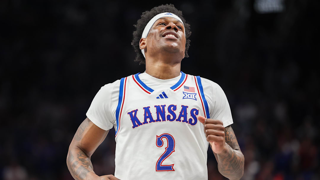 Mar 12, 2025; Kansas City, MO, USA; Kansas Jayhawks guard AJ Storr (2) reacts after a play during overtime against the UCF Knights at T-Mobile Center. 