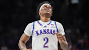 Mar 12, 2025; Kansas City, MO, USA; Kansas Jayhawks guard AJ Storr (2) reacts after a play during overtime against the UCF Knights at T-Mobile Center. 