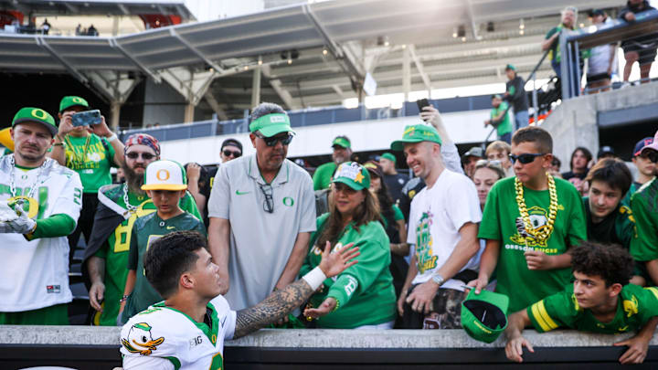 Oregon Ducks quarterback Dillon Gabriel (8) greets family after winning the annual rivalry game against the Oregon State Beavers on Saturday, Sept. 14, 2024 at Reser Stadium in Corvallis, Ore.