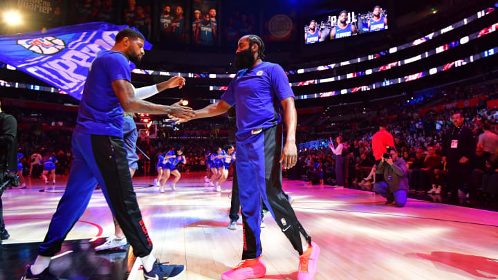 Nov 27, 2023; Los Angeles, California, USA; Los Angeles Clippers guard James Harden (1) greets forward Paul George (13) before playing against the Denver Nuggets at Crypto.com Arena. Mandatory Credit: Gary A. Vasquez-USA TODAY Sports