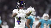 Oct 30, 2025; Miami Gardens, Florida, USA; Baltimore Ravens wide receiver Zay Flowers (4) reacts after a play against the Miami Dolphins in the third quarter at Hard Rock Stadium. Mandatory Credit: Nathan Ray Seebeck-Imagn Images