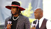 Jul 9, 2019; Cleveland, OH, USA; Pittsburgh Pirates first baseman Josh Bell (55) with Harold Reynolds on the red carpet prior to the 2019 MLB All Star Game at Progressive Field. 