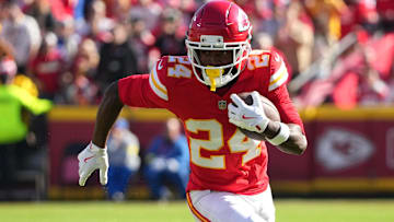 Nov 23, 2025; Kansas City, Missouri, USA;  Kansas City Chiefs running back Brashard Smith (24) runs against the Indianapolis Colts in the first half at GEHA Field at Arrowhead Stadium.