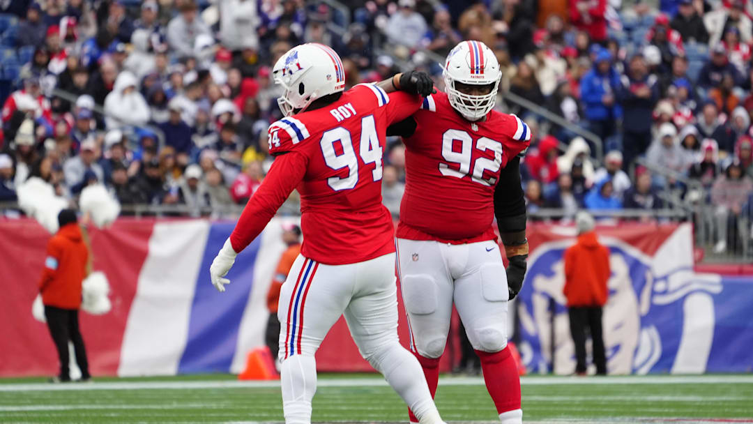 Oct 13, 2024; Foxborough, Massachusetts, USA; New England Patriots defensive tackle Jaquelin Roy (94) and New England Patriots defensive tackle Davon Godchaux (92) celebrate getting a sack against the Houston Texans during the second half at Gillette Stadium. Mandatory Credit: Gregory Fisher-Imagn Images