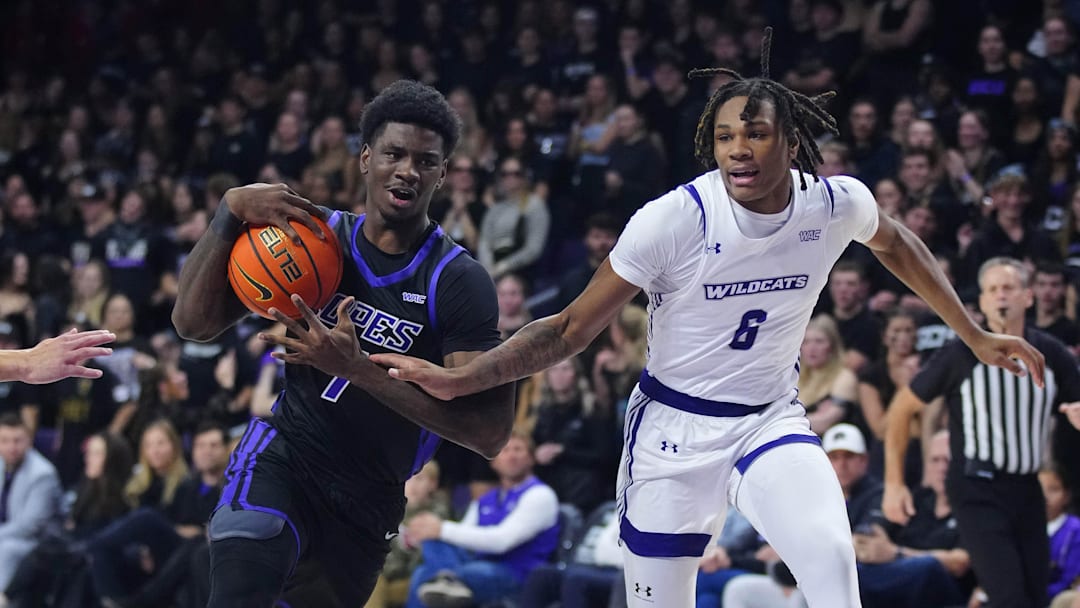 January 16, 2025; Phoenix, Ariz.; USA; GCU guard Tyon Grant-Foster (7) dribbles against ACU guard Dontrez Williams (6) during a game at Grand Canyon University.