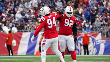 Oct 13, 2024; Foxborough, Massachusetts, USA; New England Patriots defensive tackle Jaquelin Roy (94) and New England Patriots defensive tackle Davon Godchaux (92) celebrate getting a sack against the Houston Texans during the second half at Gillette Stadium. Mandatory Credit: Gregory Fisher-Imagn Images
