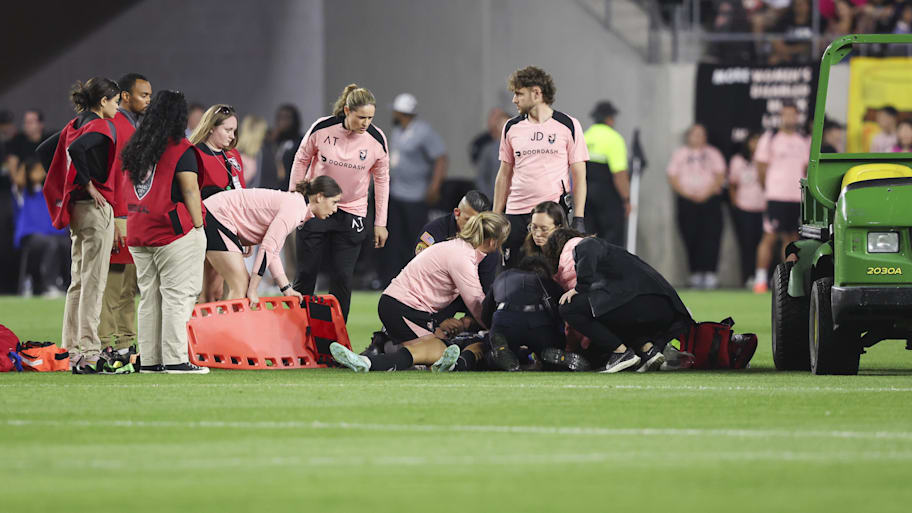 Medical personnel attend to Savy King on May 9. | Jessica Alcheh-Imagn Images