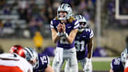 Nov 23, 2024; Manhattan, Kansas, USA; Kansas State Wildcats quarterback Avery Johnson (2) waits for the snap during the third quarter against the Cincinnati Bearcats at Bill Snyder Family Football Stadium. Mandatory Credit: Scott Sewell-Imagn Images