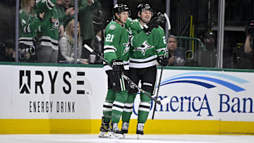 Dec 20, 2024; Dallas, Texas, USA; Dallas Stars left wing Jason Robertson (21) and center Roope Hintz (24) celebrates a goal scored by Hintz against the New York Rangers during the first period at the American Airlines Center. Mandatory Credit: Jerome Miron-Imagn Images