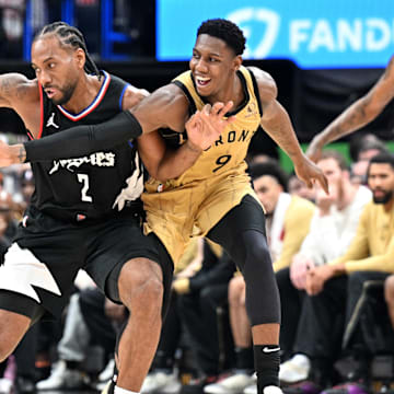 Los Angeles Clippers forward Kawhi Leonard (2) keeps the ball out of the reach of Toronto Raptors guard RJ Barrett (9) in the first half at Scotiabank Arena. Mandatory Credit: Dan Hamilton-Imagn Images