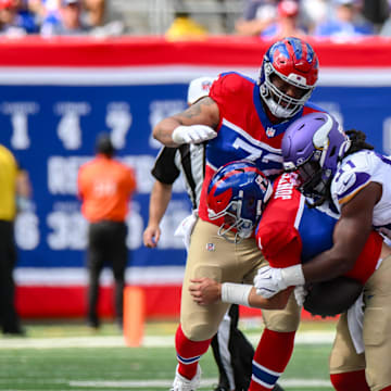 Sep 8, 2024; East Rutherford, New Jersey, USA; Minnesota Vikings linebacker Pat Jones II (91) sacks New York Giants quarterback Daniel Jones (8) during the second half at MetLife Stadium.  