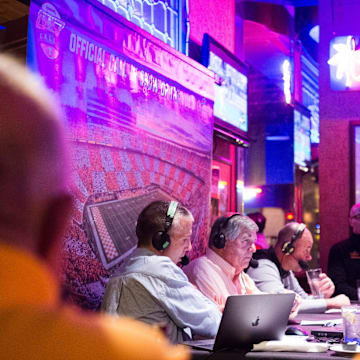 At center Bob Kesling of \"Vol Calls\"speaks while on the air at Calhoun's on the River in Knoxville, Wednesday, Oct. 24, 2019. Kesling has hosted the show for 20 years.

Volcalls1023 0027