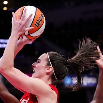 Indiana Fever guard Caitlin Clark (22) goes up for a shot Sunday, Sept. 8, 2024, during a game between the Indiana Fever and the Atlanta Dream at Gainbridge Fieldhouse in Indianapolis. The Fever defeated the Dream in overtime, 104-100.