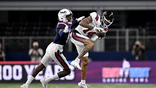 Jan 30, 2025; Arlington, TX, USA; West wide receiver Will Sheppard of Colorado (14) catches a pass in front of East defensive