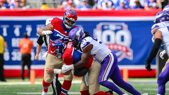 Sep 8, 2024; East Rutherford, New Jersey, USA; Minnesota Vikings linebacker Pat Jones II (91) sacks New York Giants quarterback Daniel Jones (8) during the second half at MetLife Stadium.  