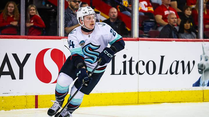 Sep 20, 2026; Calgary, Alberta, CAN; Seattle Kraken defenseman Ty Nelson (24) skates with the puck against the Calgary Flames during the second period at Scotiabank Saddledome. Mandatory Credit: Sergei Belski-Imagn Images