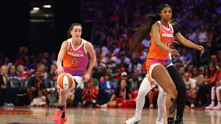 Jul 20, 2024; Phoenix, AZ, USA; Team WNBA guard Caitlin Clark (left) and Angel Reese against the USA Women's National Team during the 2024 WNBA All Star Game at Footprint Center. Mandatory Credit: Mark J. Rebilas-USA TODAY Sports