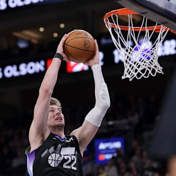 Mar 14, 2025; Salt Lake City, Utah, USA;  Utah Jazz forward Kyle Filipowski (22) attempts to dunk the ball during the first quarter against the Toronto Raptors at Delta Center. Mandatory Credit: Chris Nicoll-Imagn Images
