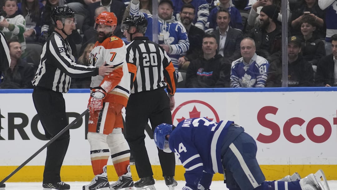 Mar 12, 2026; Toronto, Ontario, CAN; Anaheim Ducks defenseman Radko Gudas (7) looks at an injured Toronto Maple Leafs forward Auston Matthews (34) after he delivered a knee on knee hit during the second period at Scotiabank Arena. Mandatory Credit: John E. Sokolowski-Imagn Images