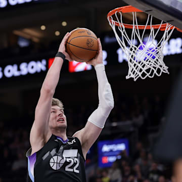 Mar 14, 2025; Salt Lake City, Utah, USA;  Utah Jazz forward Kyle Filipowski (22) attempts to dunk the ball during the first quarter against the Toronto Raptors at Delta Center. Mandatory Credit: Chris Nicoll-Imagn Images