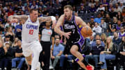 Apr 2, 2024; Sacramento, California, USA; Sacramento Kings forward Sasha Vezenkov (7) drives to the basket against LA Clippers center Daniel Theis (10) during the second quarter at Golden 1 Center. Mandatory Credit: Sergio Estrada-USA TODAY Sports