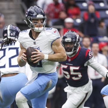 Dec 31, 2023; Houston, Texas, USA; Tennessee Titans quarterback Will Levis (8) looks for an open receiver as Houston Texans defensive end Jerry Hughes (55) applies defensive pressure during the first quarter at NRG Stadium. Mandatory Credit: Troy Taormina-USA TODAY Sports