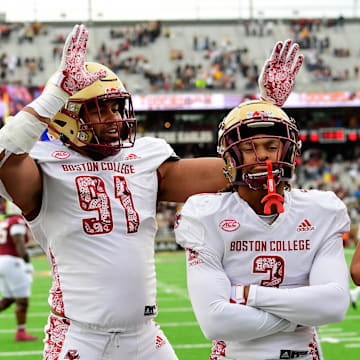 Sep 16, 2023; Chestnut Hill, Massachusetts, USA; Boston College Eagles defensive back Khari Johnson (3) celebrates his touchdown with defensive lineman George Rooks (91) and defensive back Cole Batson (23) during the second half against the Florida State Seminoles at Alumni Stadium. Mandatory Credit: Eric Canha-Imagn Images