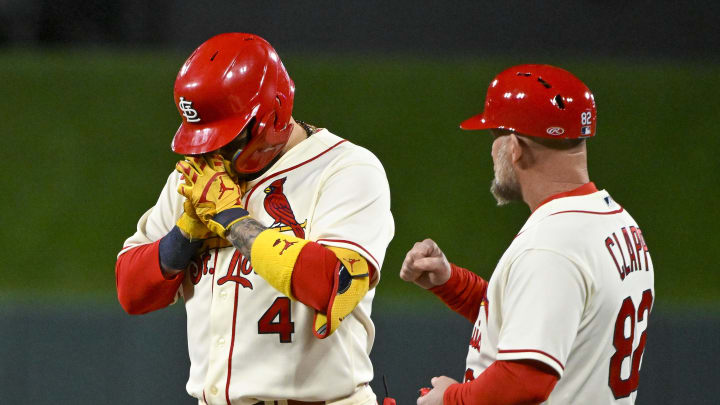 Oct 8, 2022; St. Louis, Missouri, USA; St. Louis Cardinals catcher Yadier Molina (4) reacts after hitting a single for his final postseason at bat in the ninth inning against the Philadelphia Phillies during game two of the Wild Card series for the 2022 MLB Playoffs at Busch Stadium. Mandatory Credit: Jeff Curry-USA TODAY Sports