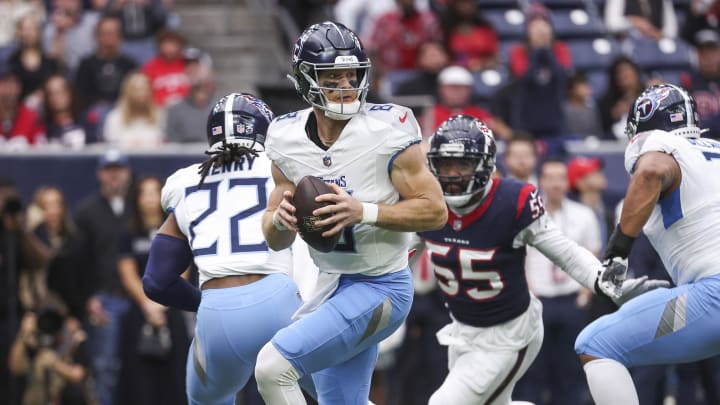 Dec 31, 2023; Houston, Texas, USA; Tennessee Titans quarterback Will Levis (8) looks for an open receiver as Houston Texans defensive end Jerry Hughes (55) applies defensive pressure during the first quarter at NRG Stadium. Mandatory Credit: Troy Taormina-USA TODAY Sports