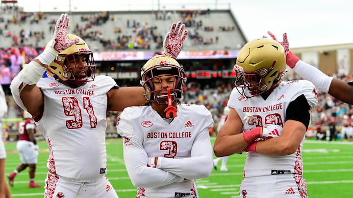 Sep 16, 2023; Chestnut Hill, Massachusetts, USA; Boston College Eagles defensive back Khari Johnson (3) celebrates his touchdown with defensive lineman George Rooks (91) and defensive back Cole Batson (23) during the second half against the Florida State Seminoles at Alumni Stadium. Mandatory Credit: Eric Canha-Imagn Images