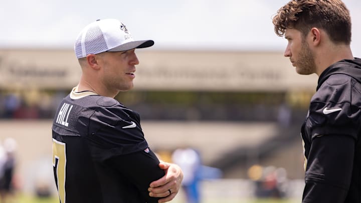Jun 10, 2025; New Orleans, LA, USA; New Orleans Saints tight end Taysom Hill (7) talks with tight end Foster Moreau (87) during minicamp at Ochsner Sports Performance Center. Mandatory Credit: Stephen Lew-Imagn Images
