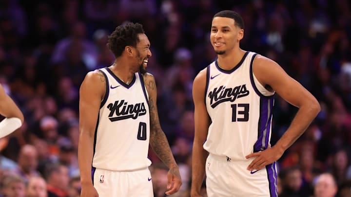 Mar 14, 2025; Phoenix, Arizona, USA; Sacramento Kings guard Malik Monk (0) and forward Keegan Murray (13) against the Phoenix Suns at Footprint Center. Mandatory Credit: Mark J. Rebilas-Imagn Images
