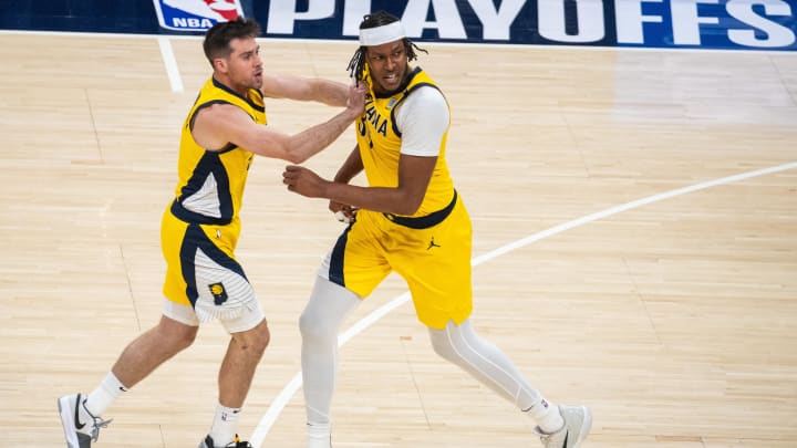 Apr 28, 2024; Indianapolis, Indiana, USA; Indiana Pacers center Myles Turner (33) and guard T.J. McConnell (9) celebrate a made basket during game four of the first round for the 2024 NBA playoffs against the Milwaukee Bucks at Gainbridge Fieldhouse. Mandatory Credit: Trevor Ruszkowski-USA TODAY Sports