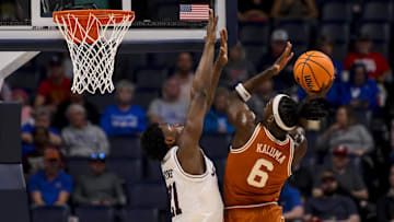 Mar 13, 2025; Nashville, TN, USA;  Texas Longhorns forward Arthur Kaluma (6) shoots over  Texas A&M Aggies forward Pharrel Payne (21) during the first half at Bridgestone Arena. Mandatory Credit: Steve Roberts-Imagn Images