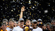 Tennessee's Drew Beam reaches up toward the confetti as players and coaches celebrate with their national championship trophy after game three of the NCAA College World Series finals between Tennessee and Texas A&M at Charles Schwab Field in Omaha, Neb., on Monday, June 24, 2024.