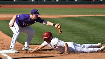 May 11 2024; Tuscaloosa, AL, USA; LSU first baseman Jared Jones takes a pick off throw but can’t get