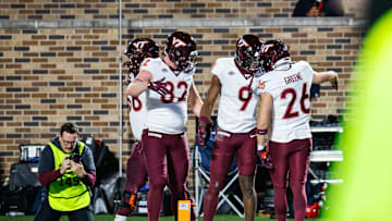 Nov 23, 2024; Durham, North Carolina, USA;  Virginia Tech Hokies wide receiver Ayden Greene (26) celebrates a touchdown with teammates during the second half of the game against Duke Blue Devils at Wallace Wade Stadium. Mandatory Credit: Jaylynn Nash-Imagn Images