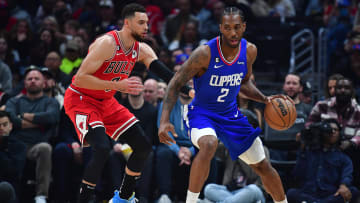 Mar 27, 2023; Los Angeles, California, USA; Los Angeles Clippers forward Kawhi Leonard (2) moves the ball against Chicago Bulls guard Zach LaVine (8) during the first half at Crypto.com Arena.