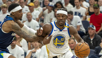 May 14, 2025; Minneapolis, Minnesota, USA; Golden State Warriors forward Jimmy Butler III (10) drives to the basket past Minnesota Timberwolves forward Jaden McDaniels (3) in the second half during game five of the second round for the 2025 NBA Playoffs at Target Center. Mandatory Credit: Jesse Johnson-Imagn Images