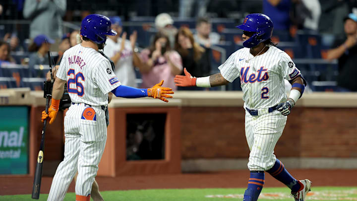 Sep 17, 2024; New York City, New York, USA; New York Mets shortstop Luisangel Acuna (2) celebrates his solo home run against the Washington Nationals with second baseman Eddy Alvarez (26) during the eighth inning at Citi Field. The home run was the first of his major league career. Mandatory Credit: Brad Penner-Imagn Images